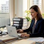 HR manager reviewing compliance spreadsheet