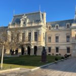 a large building with a clock on the front of it
